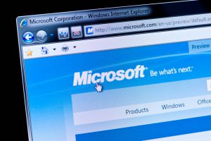 Essen, Germany - February 28, 2011: Part of Microsoft site in Internet Explorer browser on LCD screen. Microsoft was founded in 1975 by Bill Gates and Paul Allen. The company is known for its Windows operating system and its Office software Office.